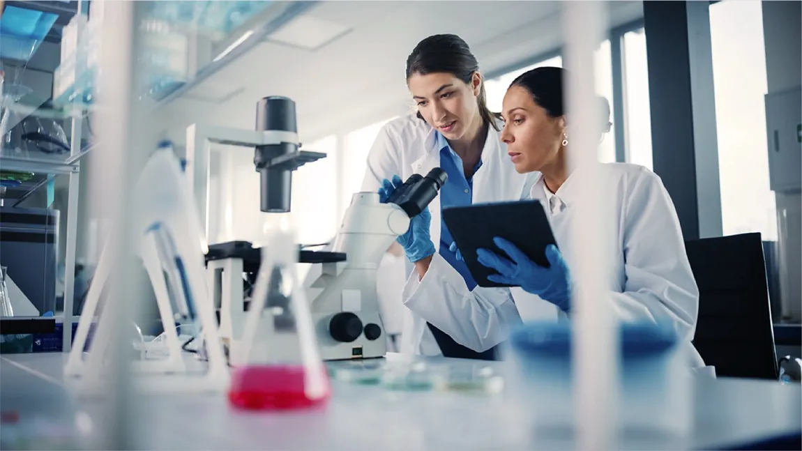 Two researchers analysing samples together